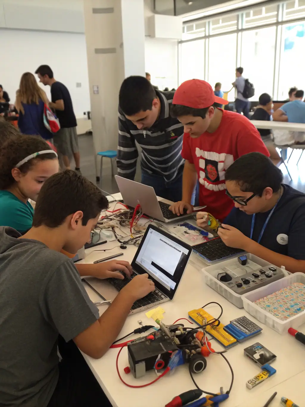 A diverse group of students collaborating on a robotics project, surrounded by various components and tools, in a well-equipped lab. The image should convey teamwork and innovation.